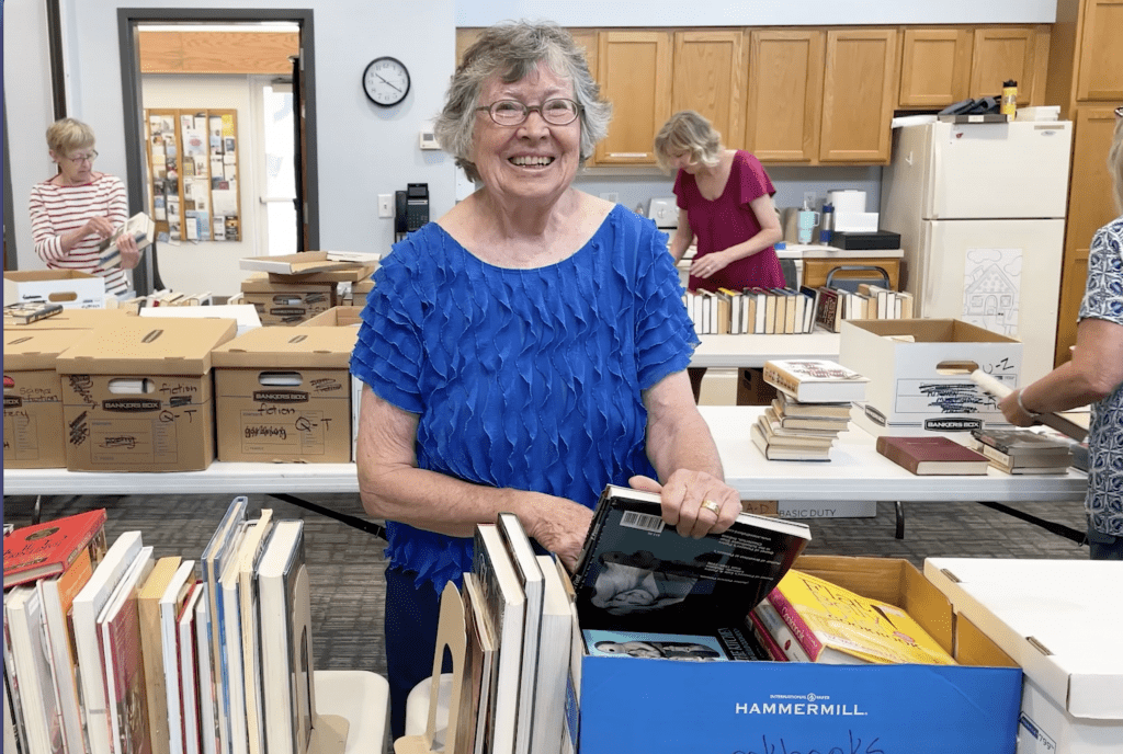 Friend of the library setting up the book sale