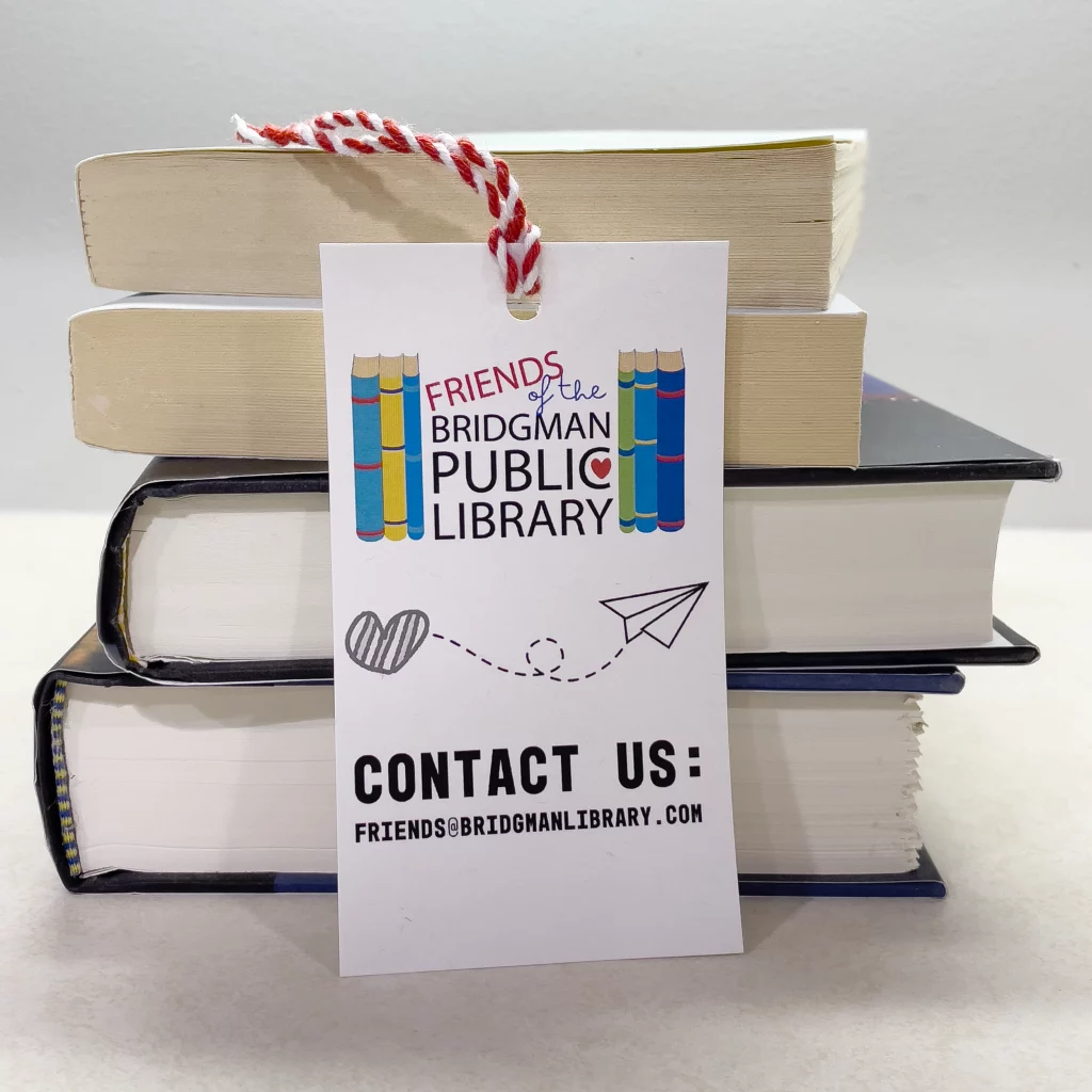 Bookmark against a stack of books that says, contact us.