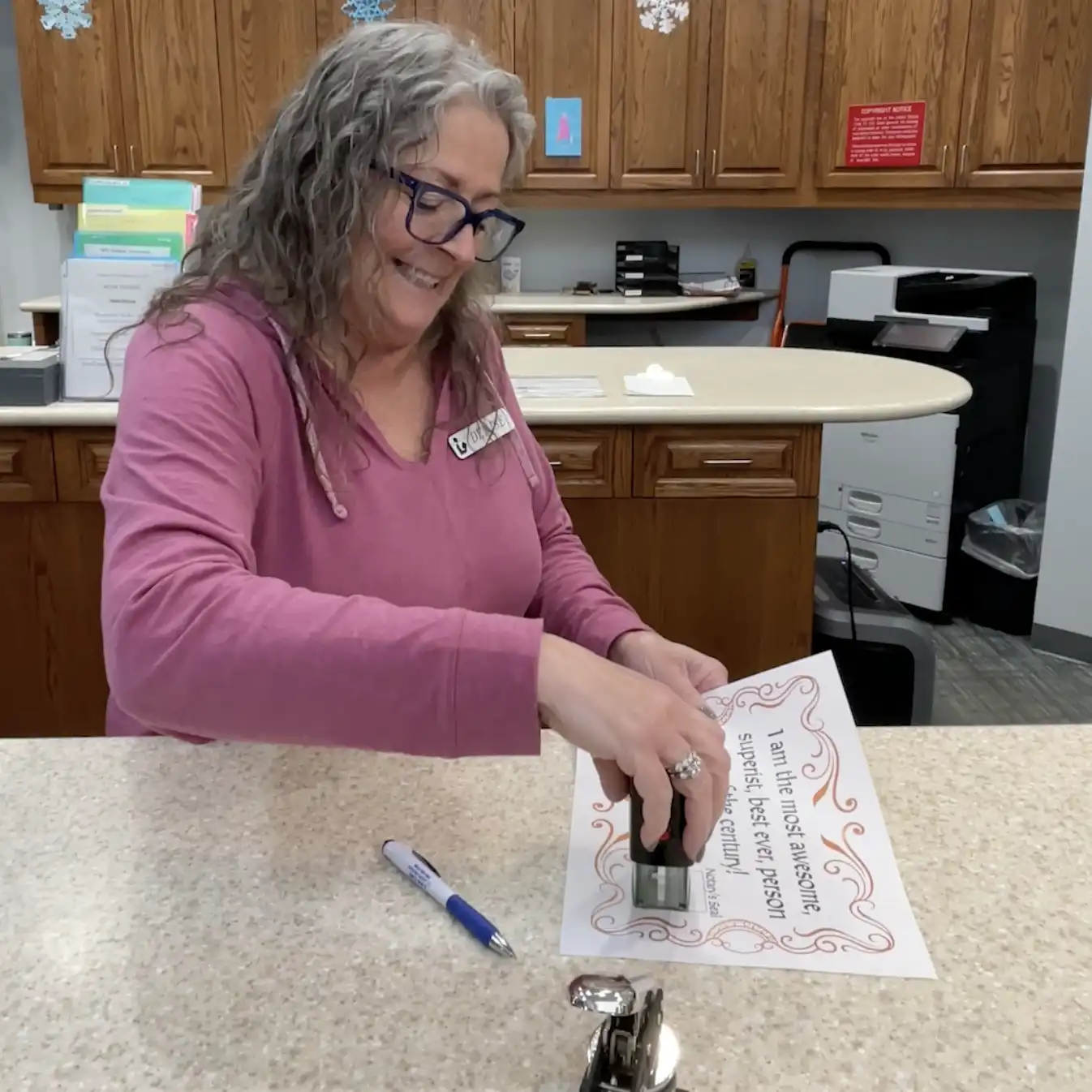 Notary Denise performs a notarizes a document.